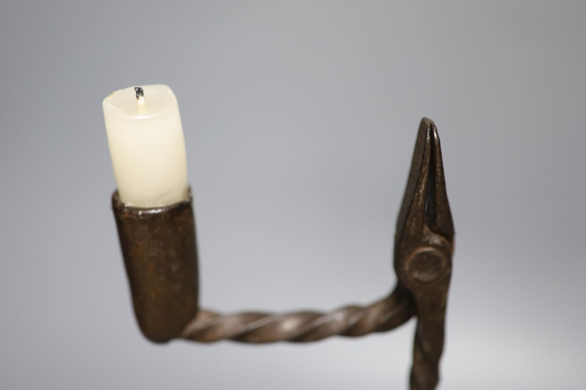 A Georgian wrought iron rush light/candlestick, height 37cm